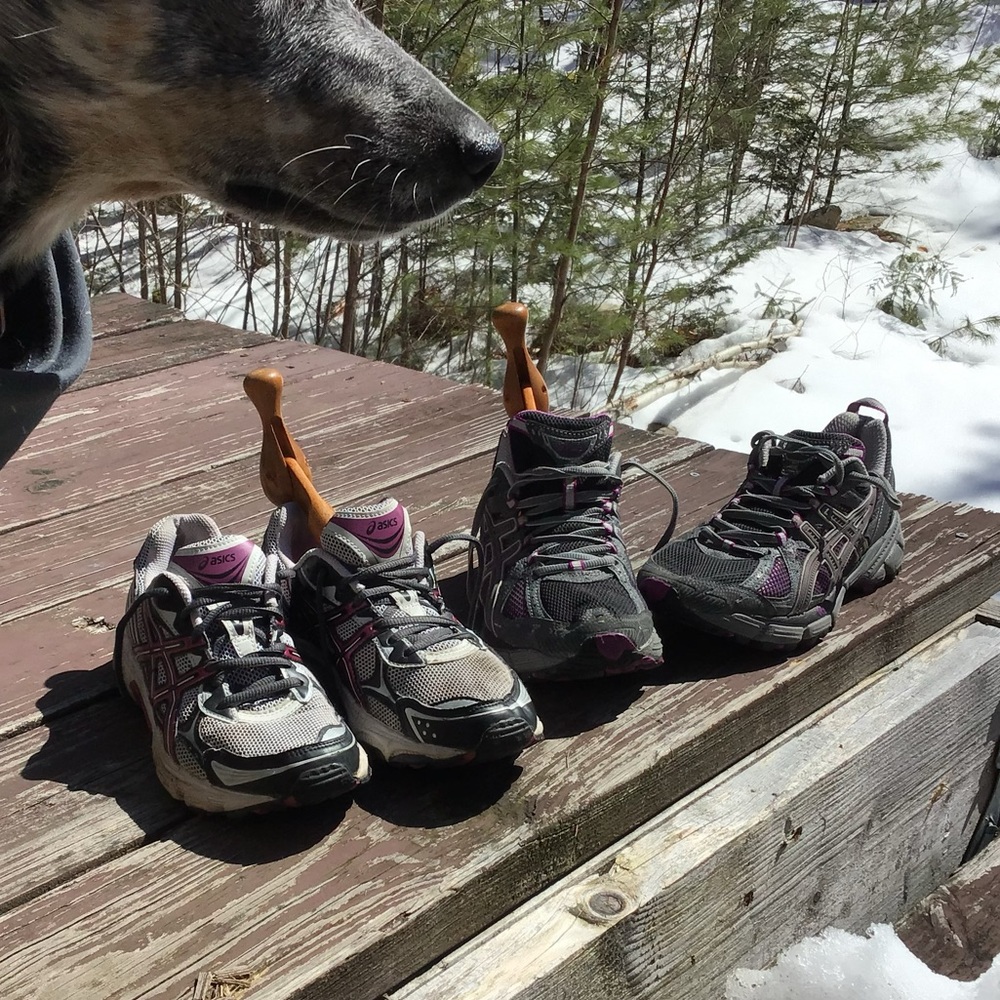 two pairs asics running shoes